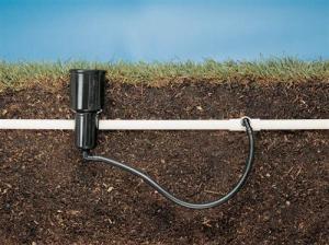 a cut out view of a sprinkler line connection